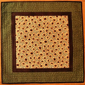FALL QUILTED Square shaped with Mini Sun Flowers pattern as the center attraction on the quilt Deep green, brown golden yellow SUN flowers.