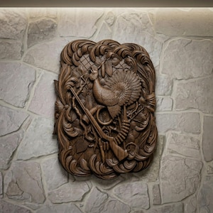 May include: A detailed, carved wooden wall art piece featuring a turkey, a rifle, and foliage. The artwork is a rich brown color and is mounted on a stone wall. The turkey is the central focus, with its feathers and details meticulously carved.