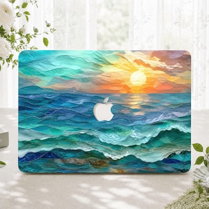 May include: A laptop skin featuring a vibrant sunset over a textured ocean scene with layered shades of teal, blue, and turquoise waves. The sky transitions from orange to yellow with a bright sun, centred by a white Apple logo cutout.
