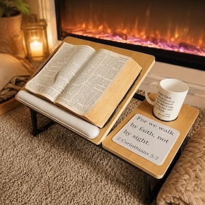 May include: A wooden lap desk with an open book, a white mug with text, and a small white sign with text. The sign reads "For we walk by faith, not by sight. 2 Corinthians 5:7". The mug says "Dear Dad".