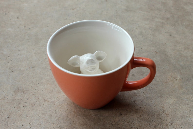 Ceramic pig inside the mug