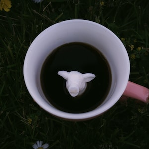 It's Pig at the bottom of the coffee mug