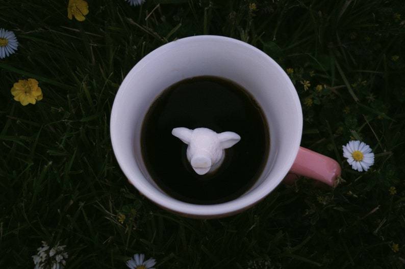 It's Pig at the bottom of the coffee mug