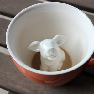 Piggy at the bottom of the coffee mug