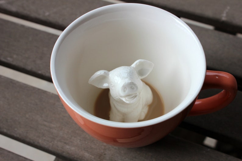 Piggy at the bottom of the coffee mug