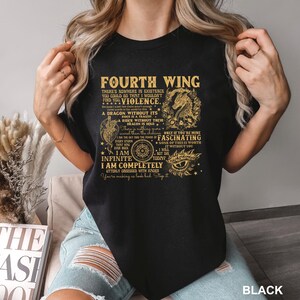 May include: Black t-shirt with gold text featuring the words "Fourth Wing" and a dragon graphic. The shirt includes various quotes and phrases. The word "BLACK" is printed at the bottom right.
