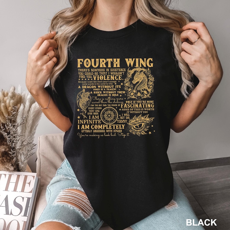 May include: Black t-shirt with gold text featuring the words "Fourth Wing" and a dragon graphic. The shirt includes various quotes and phrases. The word "BLACK" is printed at the bottom right.