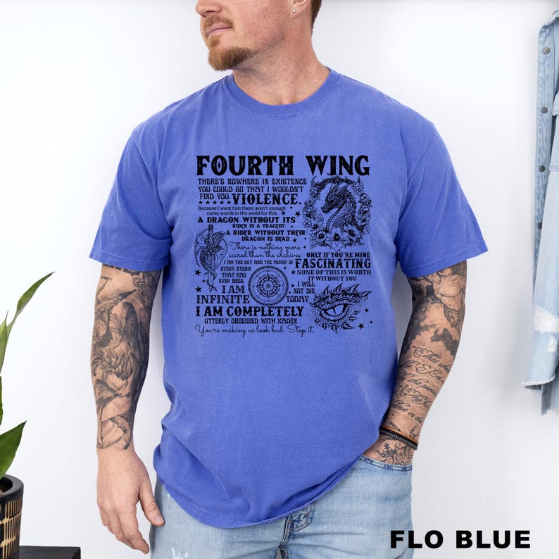 May include: A blue t-shirt with the text "FOURTH WING" and a dragon graphic. The shirt has additional text with phrases like "A dragon without its rider is a tragedy" and "I am completely utterly obsessed with Xaden."