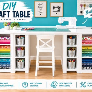 May include: A white craft table with a spacious work surface, multiple storage cubbies, and side shelves for fabric. The table features a white chair, a sewing machine, and metal buckets holding supplies. Text reads: DIY CRAFT TABLE SEW CRAFT CREATE.