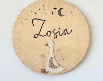 A personalized wooden goose night light designed to become part of a child’s bedtime memories-a timeless and meaningful gift for new parents