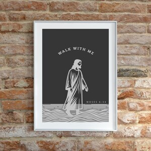 May include: A framed print with a dark gray background featuring a white illustration of a figure in a robe walking on water. The text "WALK WITH ME" is arched above the figure, with "MOSES 6:34" below.
