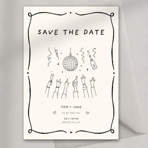 May include: A cream-coloured "Save the Date" card with black line art. The card features a disco ball, champagne bottle, and raised hands. The text reads "Save the Date," with the names "Tom + Jane" and wedding details.