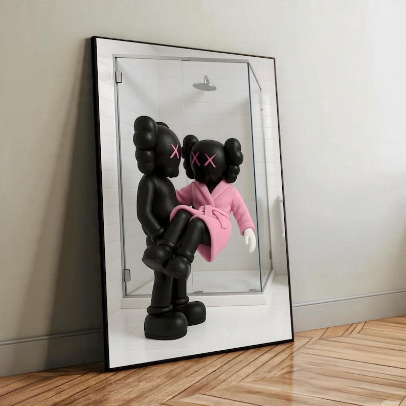 May include: A black framed mirror featuring two KAWS Companion figures. One figure is holding the other, who is wearing a pink robe. The figures have black bodies with pink XX eyes. The mirror reflects a shower.