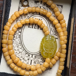 Java Glass Bead Necklace with Hand-Carved Green Stone Centerpiece