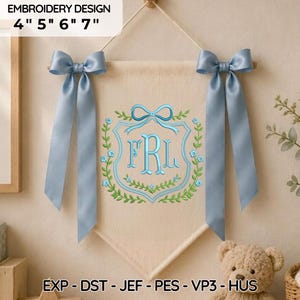 May include: A cream-colored fabric banner featuring an embroidered crest with the letters FRL in light blue, surrounded by a green vine and blue flowers. Two light blue satin ribbons are tied at the top corners. Text reads EMBROIDERY DESIGN 4" 5" 6" 7" and EXP - DST - JEF - PES - VP3 - HUS.