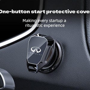 May include: A black and silver car ignition button cover with the Infiniti logo. The cover is installed on a black dashboard. Text above reads, "One-button start protective cover." Below, text reads, "Making every startup a ritualistic experience."