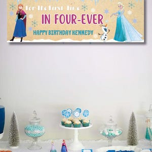 May include: A banner with the text "For The First Time In Four-Ever Happy Birthday Kennedy" featuring illustrations of Anna, Elsa, and Olaf from the movie Frozen. The banner is tan with blue and purple text.