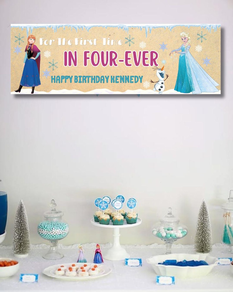 May include: A banner with the text "For The First Time In Four-Ever Happy Birthday Kennedy" featuring illustrations of Anna, Elsa, and Olaf from the movie Frozen. The banner is tan with blue and purple text.