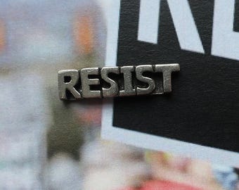 Resist Pewter Lapel Pin- CC728- Fight, Raise Awareness, and Promote people's for Justice and Liberation