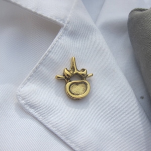 Gold Vertebra Lapel Pin- CC594G- Chiropractor and Anatomy Pins- Spine, Neuromuscular, and Alternative Medicine Pins