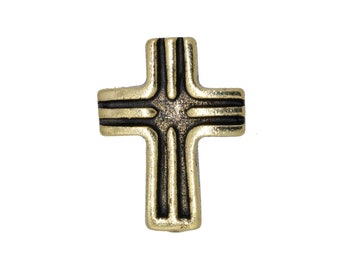 Puede incluir: Una cruz dorada con un centro oscuro y texturizado y detalles negros. La cruz tiene un diseño clásico con una apariencia ligeramente envejecida, adecuada para joyería religiosa o proyectos de artesanía.
