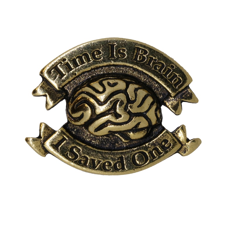 May include: Gold-colored metal pin with a brain design and the text "Time Is Brain I Saved One".