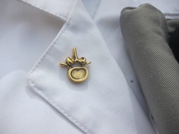 Gold Vertebra Lapel Pin- CC594G- Chiropractor and Anatomy Pins- Spine, Neuromuscular, and Alternative Medicine Pins