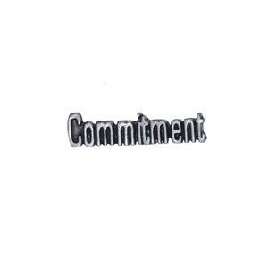 May include: Silver charm with the word "Commitment" spelled out in raised letters.