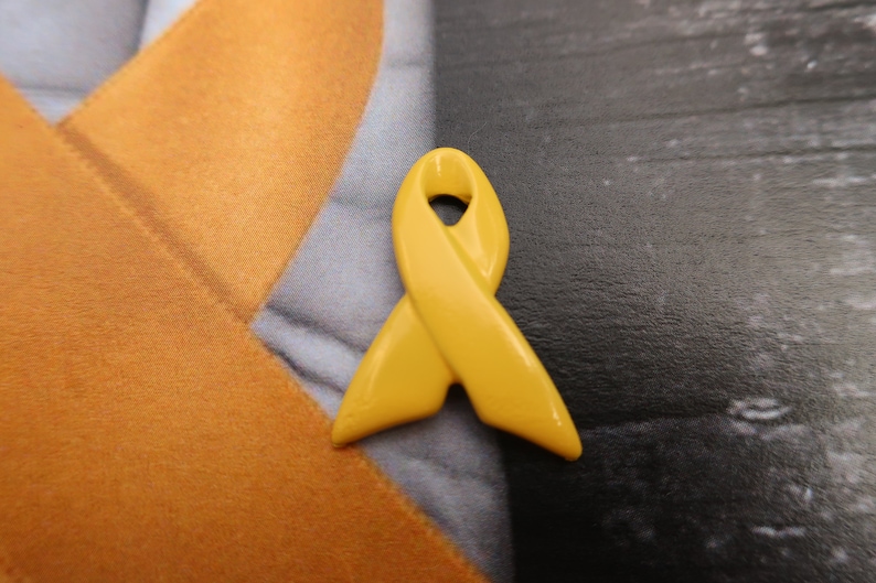 Yellow Ribbon Pin- Raise Awareness for Adoption, Bladder and Liver Cancer, Endometriosis, Hope, Hunger, Military, and Suicide Prevention image 1