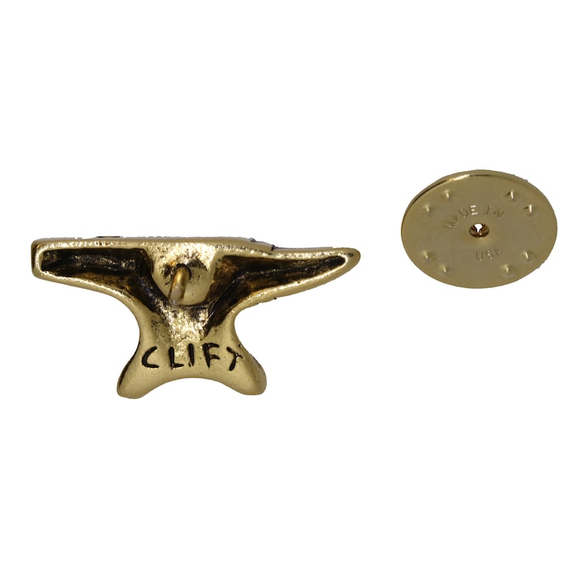 May include: Gold-toned metal anvil pin with the word "CLIFT" engraved on the bottom. The back of the pin has a circular backing with "MADE IN USA" engraved on it.