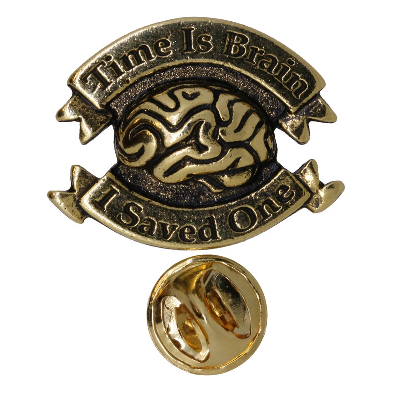 May include: Gold-toned pin with a brain design and the text "Time Is Brain I Saved One".