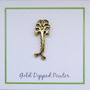 May include: Gold dipped pewter charm in the shape of a stylized tree with a single trunk and multiple branches. The charm is on a white card with green border and the text "Gold Dipped Pewter".
