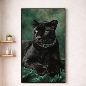 May include: A framed portrait of a black panther wearing a green jeweled collar. The panther is lying on a green velvet cloth against a green backdrop. The panther's eyes are green, and the image is framed in black.