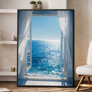 May include: Framed artwork showing an open window with a view of a bright blue sea and sky. White curtains are draped around the window frame. The image creates a feeling of peace and serenity, suggesting a coastal theme.