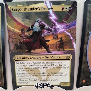 May include: A Magic: The Gathering card featuring "Zurgo, Thunder's Decree," a Legendary Orc Warrior. The card art depicts a muscular figure with red and purple accents, wielding lightning. The card has a gold border and includes game text.