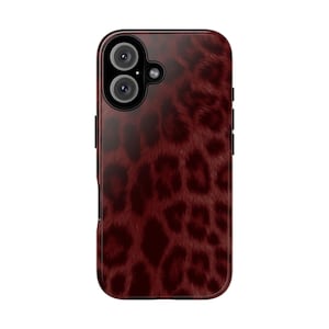 May include: A burgundy phone case with a leopard print design. The case has a glossy finish and features a camera cutout with three lenses. The leopard print pattern is a dark red color.