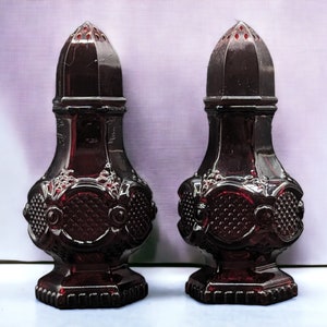 The Avon Cape Cod 1867 Ruby Red Glass Salt & Pepper Shakers are a Delightful Vintage Collectible