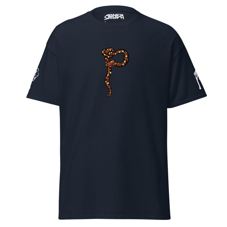 May include: Navy blue t-shirt with a brown and yellow snake design. The word "SIGNEA" is printed in white on the upper center of the shirt. White graphics are on the sleeves.
