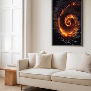 May include: A framed abstract art print featuring a fiery spiral design in shades of orange and black. The artwork is displayed above a cream-colored sofa with several pillows. The room has a neutral color palette with a wooden side table.
