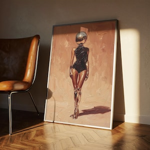 May include: Framed artwork depicting a figure with a mirrored head and metallic legs and boots, wearing a black bodysuit. The background is a textured, peach-coloured surface. A brown leather chair is in the background.