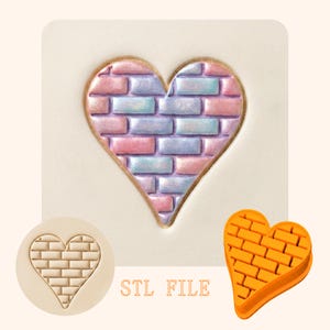 May include: A heart-shaped design with a brick pattern in shades of pink, blue, and purple. The design is outlined in gold. The image also includes a stamp and a 3D model of the heart with the brick pattern. The text "STL FILE" is visible.