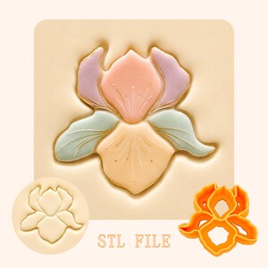 May include: A cookie cutter set featuring an iris flower design, including a beige stamp with an embossed iris shape, an orange plastic cutter, and a central image of a decorated iris cookie in pastel pink, purple, and green with gold accents.