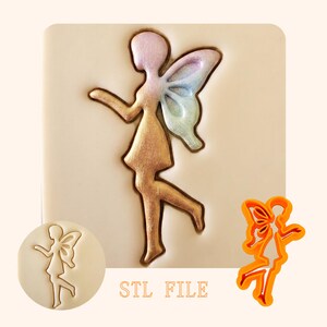 May include: A fairy-shaped cookie cutter in bright orange plastic, accompanied by a beige embossed impression showing a fairy with a gradient-colored wing design. The text "STL FILE" is printed in orange below the embossed fairy figure.