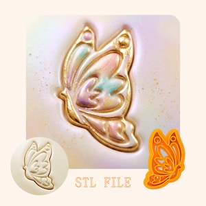 May include: A digital file for a butterfly-shaped cookie cutter, featuring a gold-outlined butterfly design with pastel pink, blue, and purple accents. The image displays the embossed result, a plain white circular impression, and an orange plastic cutter. STL FILE.