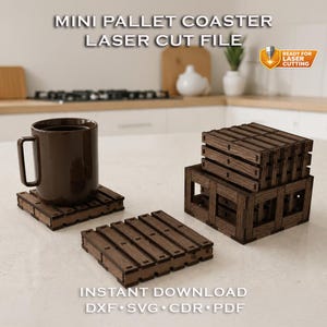 May include: Wooden mini pallet coasters, laser cut file. A brown mug sits on one coaster. The coasters are made of dark brown wood and are designed to look like miniature pallets. The image includes the text "MINI PALLET COASTER LASER CUT FILE".