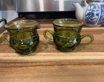 Vintage Indiana Green Glass Creamer and Sugar set with King's Crown pattern.