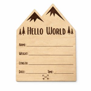 May include: Wooden birth announcement sign with a mountain-shaped top and the words "HELLO WORLD." The sign has spaces to write the baby's name, weight, length, date, and time. The design includes mountain and tree illustrations.