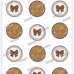 May include: Sheet of round stickers with a pink background and a black border. Some stickers feature a leopard print bow, while others have a leopard print pattern. The word "Sample" is printed on each sticker.