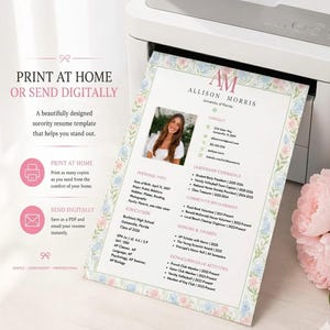 May include: A resume template printed on paper featuring a floral border with pink and blue flowers. The document includes a photograph of a person, contact details, education, leadership experience, community involvement, and honours sections.