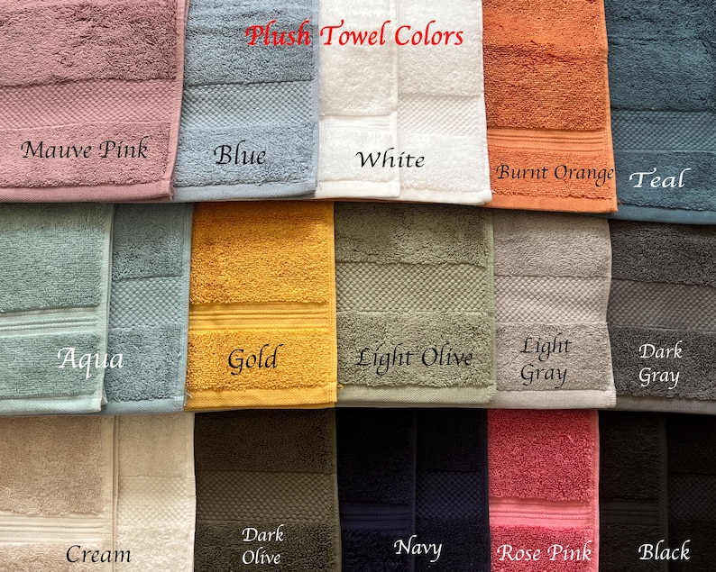 May include: A collection of plush towels in various colors, including mauve pink, blue, white, burnt orange, teal, aqua, gold, light olive, light gray, dark gray, cream, dark olive, navy, rose pink, and black. The towels are arranged in two rows, with the colors labeled below each towel.